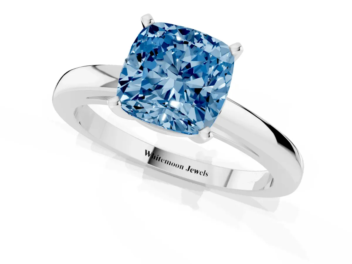 Fancy Blue Cushion Cut Solitaire Diamond Engagement Ring with Four-Prong Setting on a Classic Band Platinum
