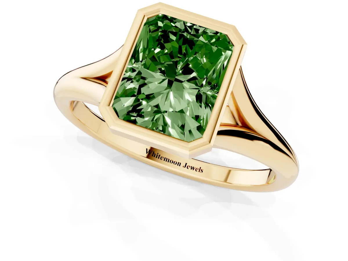 Fancy Green Bezel Set Radiant Cut Cut Solitaire Ring with Tapered Band Yellow gold