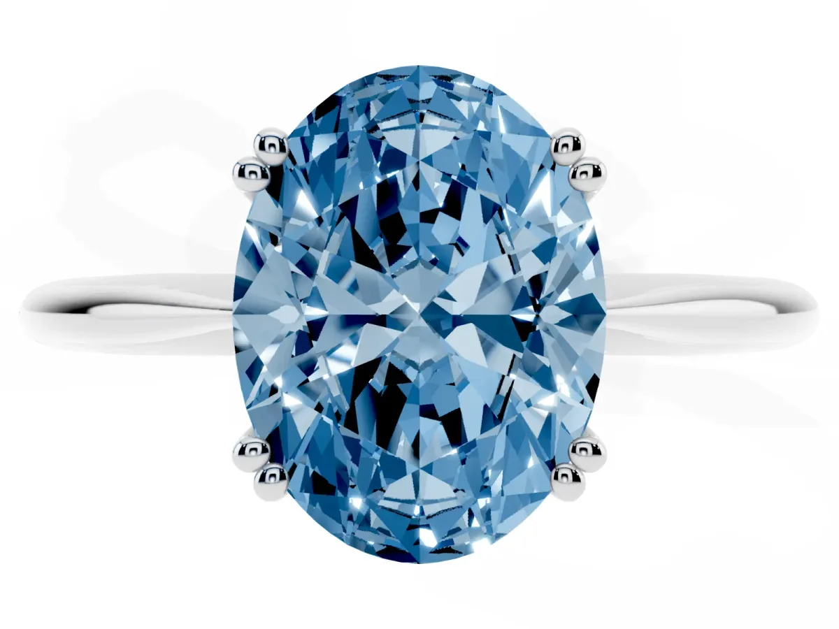 Fancy Blue Oval Cut Solitaire Diamond Ring with Six-Prong Setting and Classic Band Silver