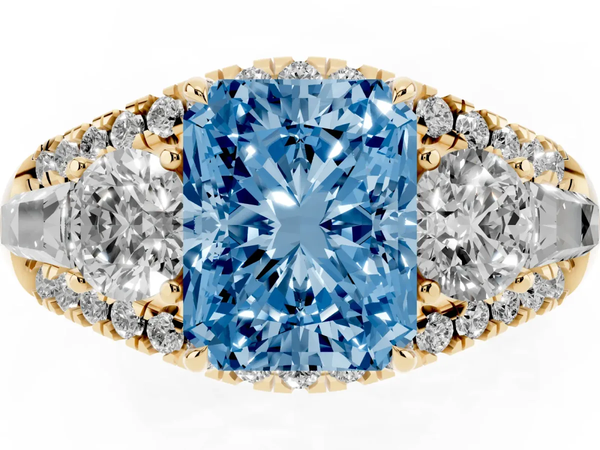Fancy Blue Three-Stone Radiant Cut Diamond Engagement Ring with Pave Band and Prong Setting Yellow gold