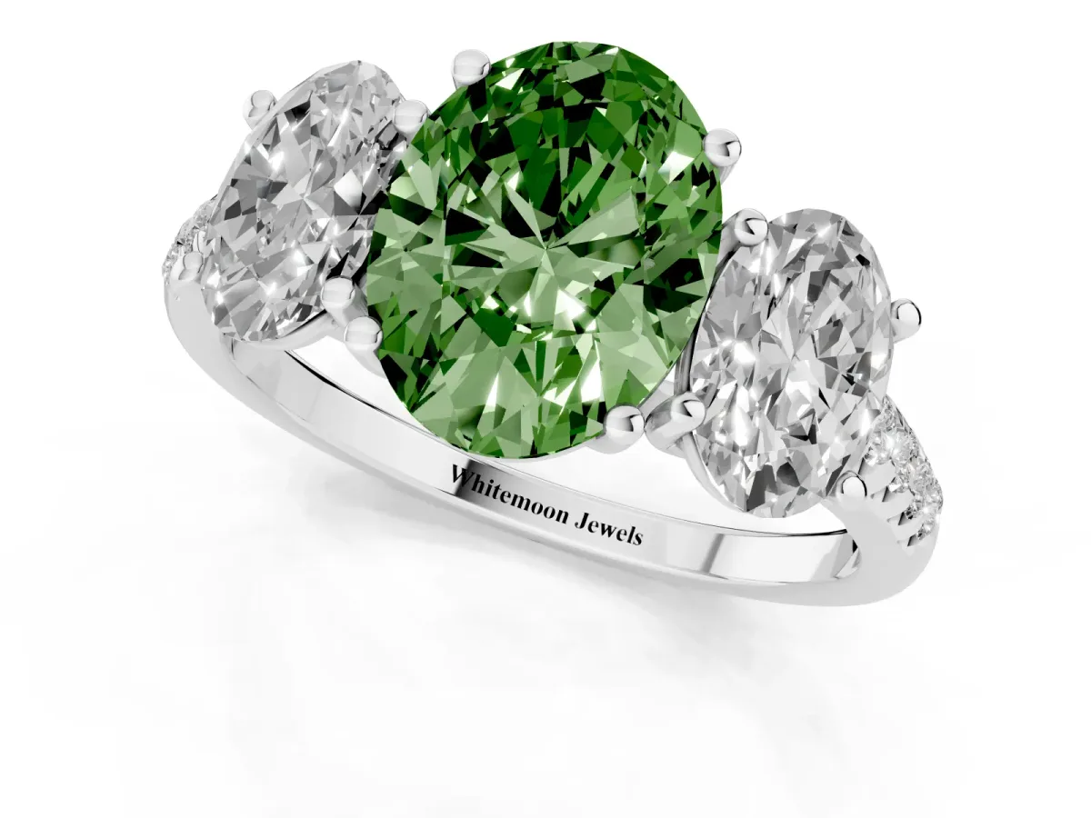 Fancy Green Three-Stone Oval Cut Diamond Ring with Round Pavé Band and Prong Setting Silver