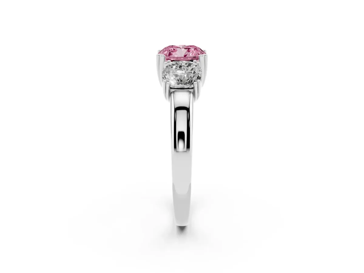 Fancy Pink Three-Stone Cushion Cut Cut Diamond Ring with Channel Set Band and Four-Prong Setting Platinum