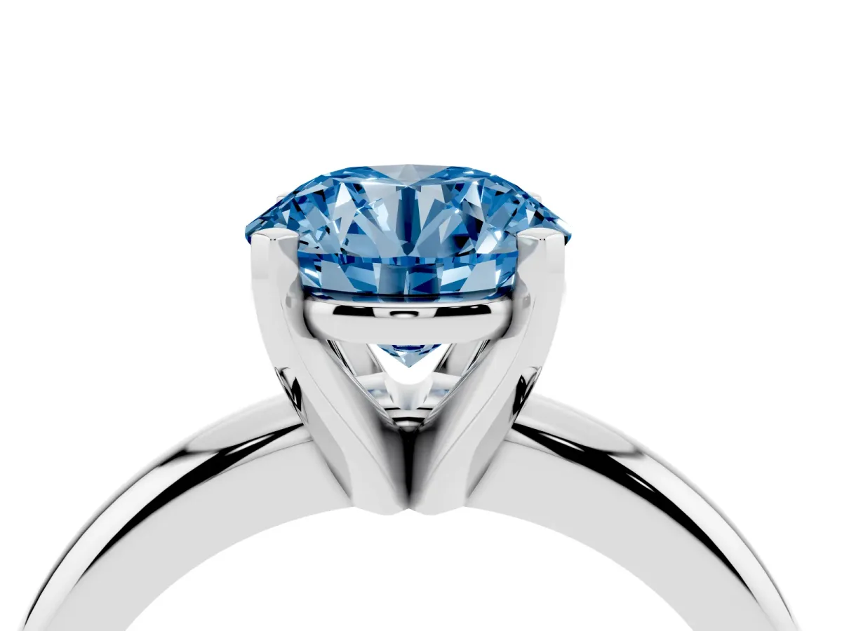 Fancy Blue Round Cut Diamond Solitaire Engagement Ring with Round Band and Four-Prong Setting Silver