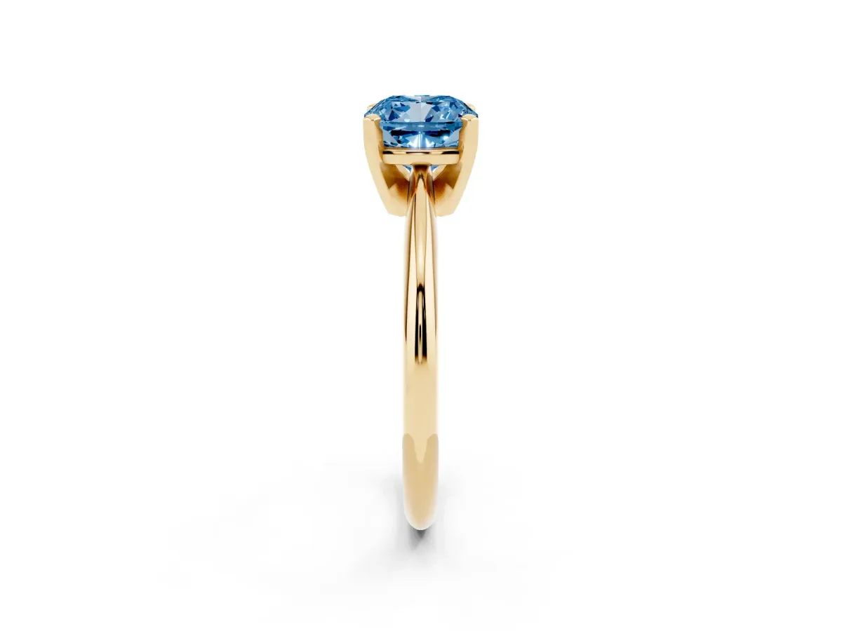 Fancy Blue Cushion Cut Cut Solitaire Ring with Four-Prong Setting on a Classic Band Yellow gold