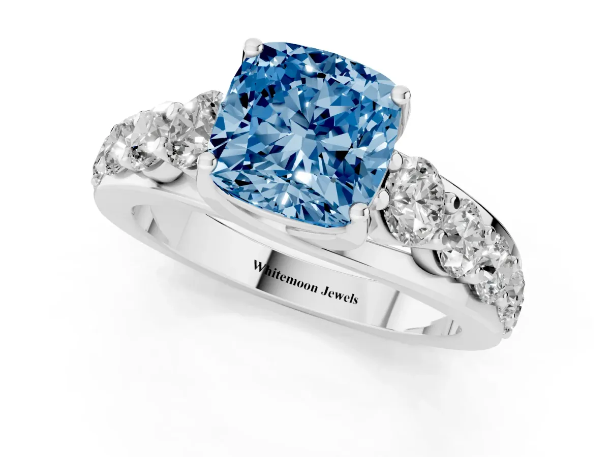 Fancy Blue Cushion Cut Diamond Engagement Ring with Pavé Band and Four-Prong Setting Silver