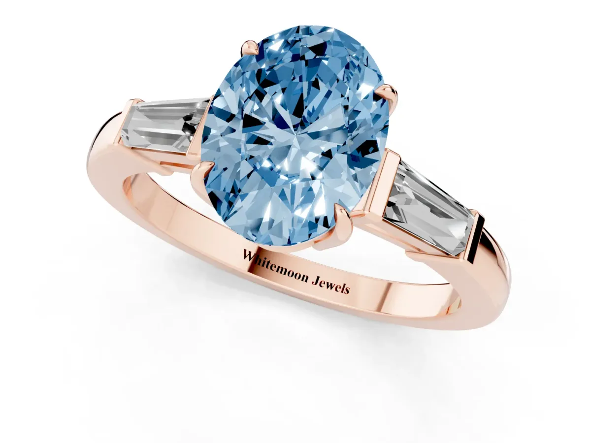 Fancy Blue Oval Cut Diamond Three-Stone Ring with Tapered Baguette Side Stones and Prong Setting Rose gold