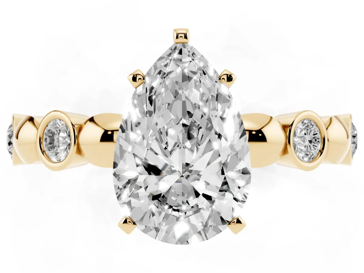 Pear Cut Solitaire Bezel-Set Diamond Ring with Beaded Band and Four-Prong Setting Yellow gold