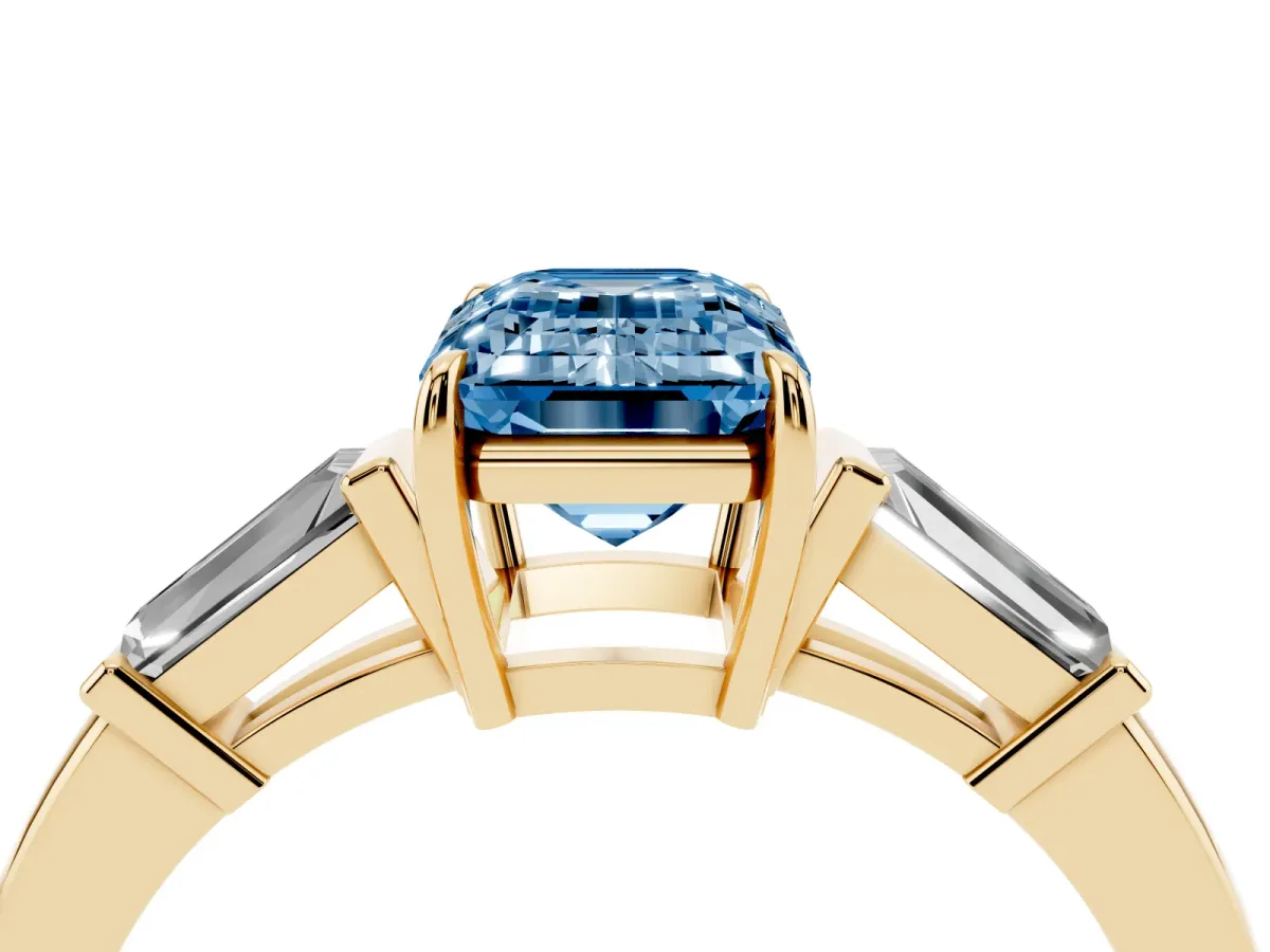 Fancy Blue Emerald Cut Diamond Three-Stone Ring with Tapered Baguette Side Stones and Prong Setting Yellow gold