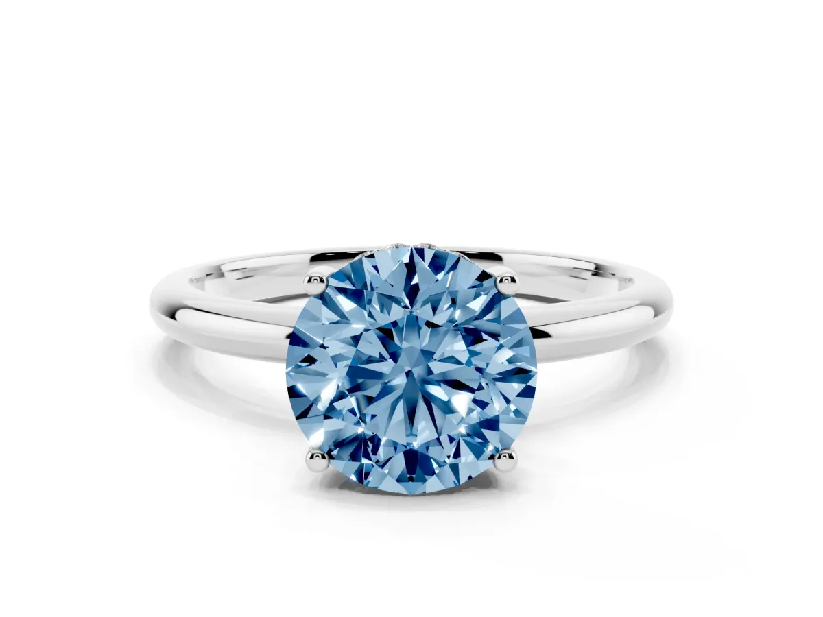 Fancy Blue Round Cut Cut Solitaire Engagement Ring with Four-Prong Setting and Classic Band Silver
