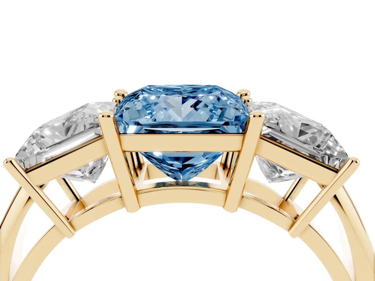 Fancy Blue Three-Stone Princess Cut Cut Diamond Engagement Ring with Prong Setting on a White Gold Band Yellow gold