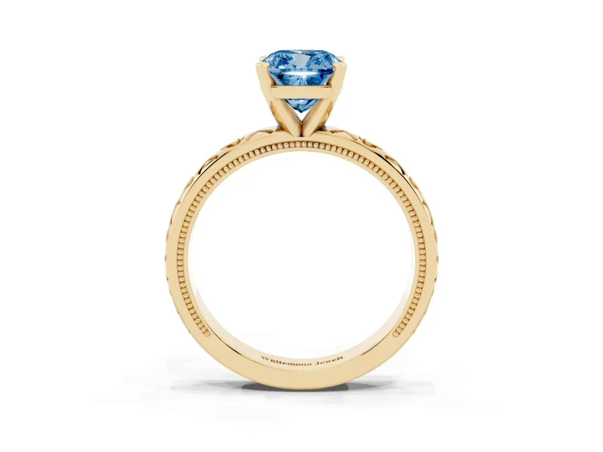 Fancy Blue Cushion Cut Solitaire Diamond Engagement Ring with XO Engraved Band and Four-Prong Setting Yellow gold