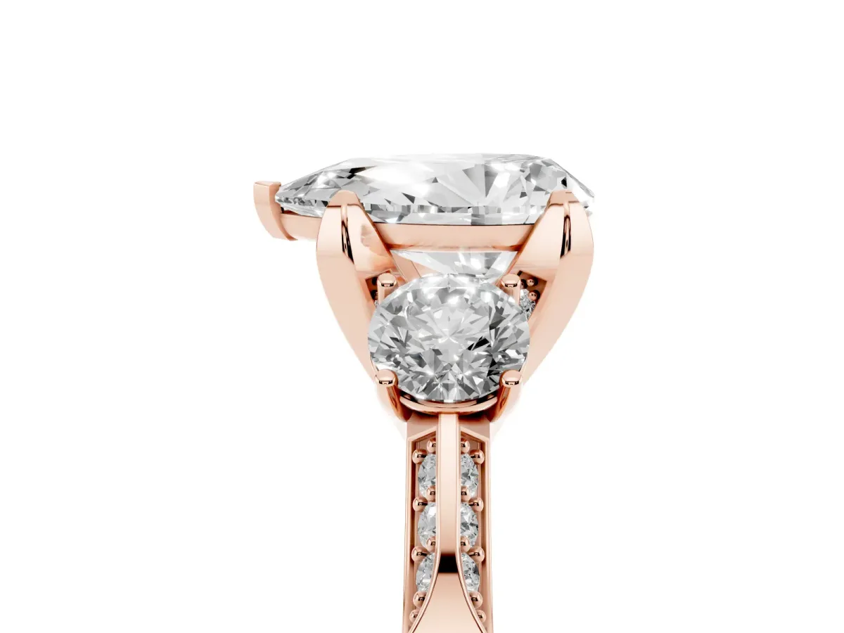 Pear Cut Brilliant Three-Stone Diamond Ring with Pavé Band and Four-Prong Setting Rose gold
