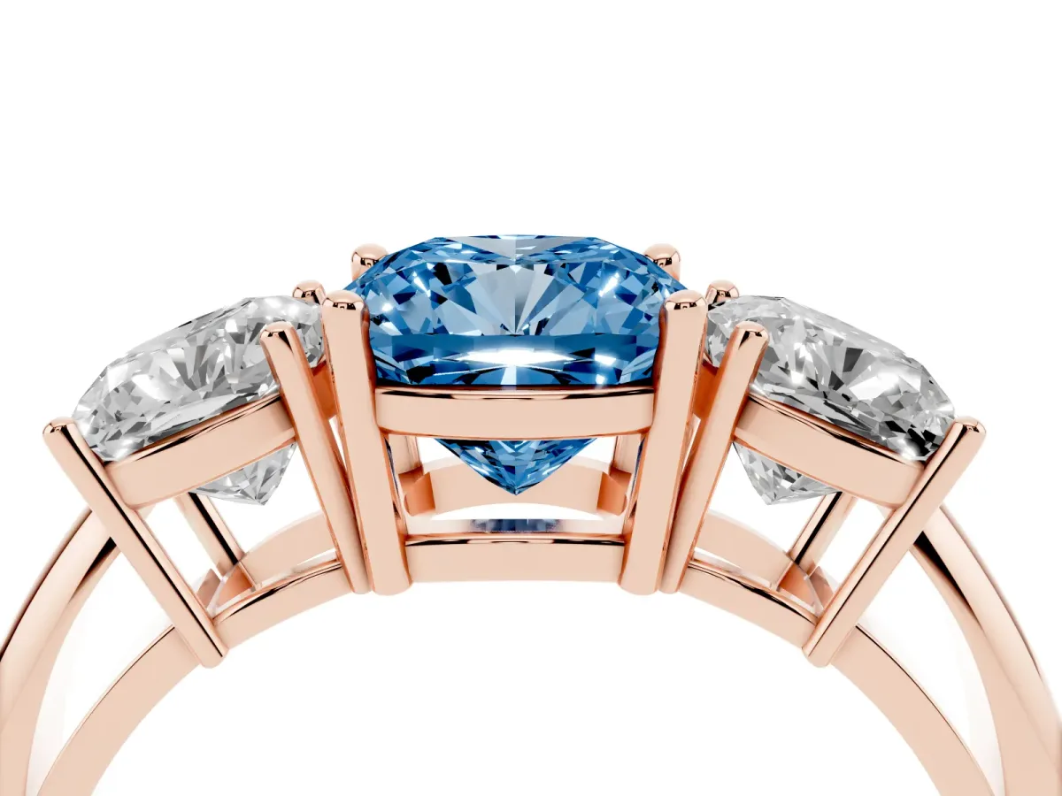 Fancy Blue Three-Stone Cushion Cut Cut Diamond Engagement Ring with Prong Setting on a White Gold Band Rose gold