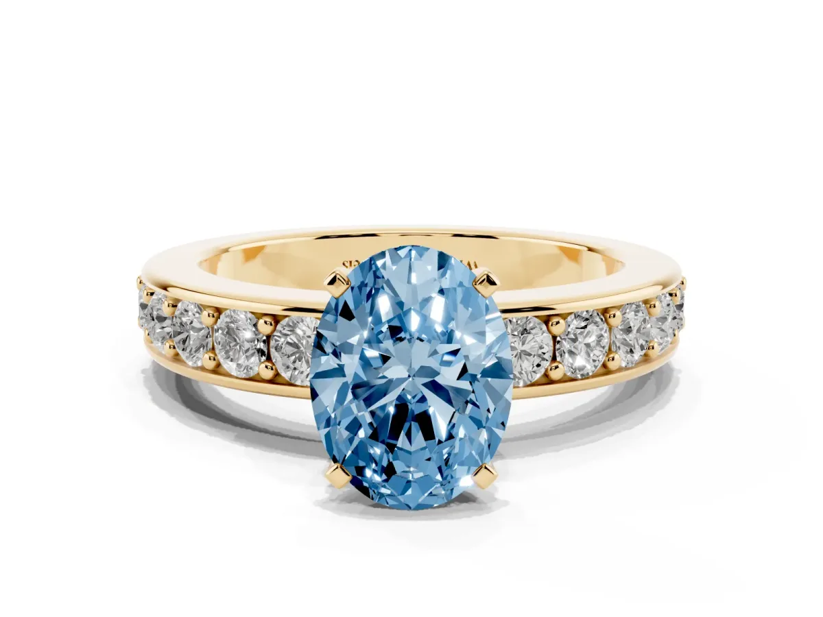 Fancy Blue Oval Cut Diamond Engagement Ring with Channel Set Round Band and Prong Setting Yellow gold