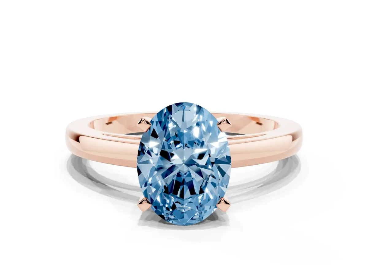 Fancy Blue Oval Cut Solitaire Diamond Engagement Ring with Four-Prong Setting on a Classic Band Rose gold