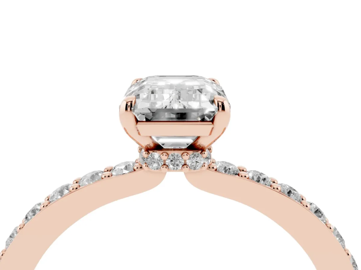 Emerald Cut Diamond Solitaire Engagement Ring with Pavé Band and Four-Prong Setting Rose gold