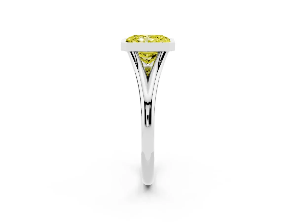 Fancy Yellow Bezel Set Radiant Cut Cut Solitaire Ring with Tapered Band Platinum