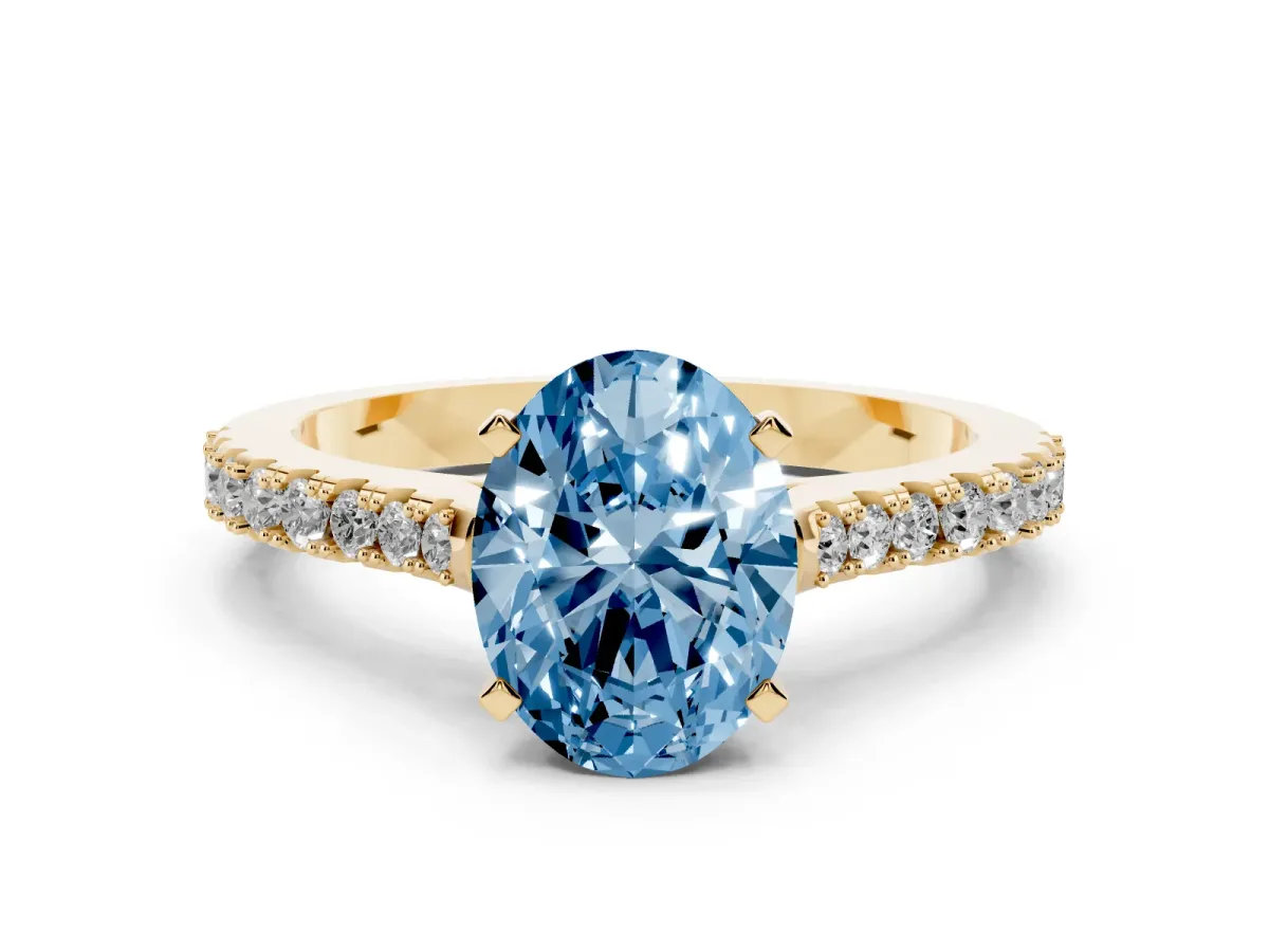 Fancy Blue Oval Cut Cut Solitaire Diamond Engagement Ring with Pave Band and Four-Prong Setting Yellow gold