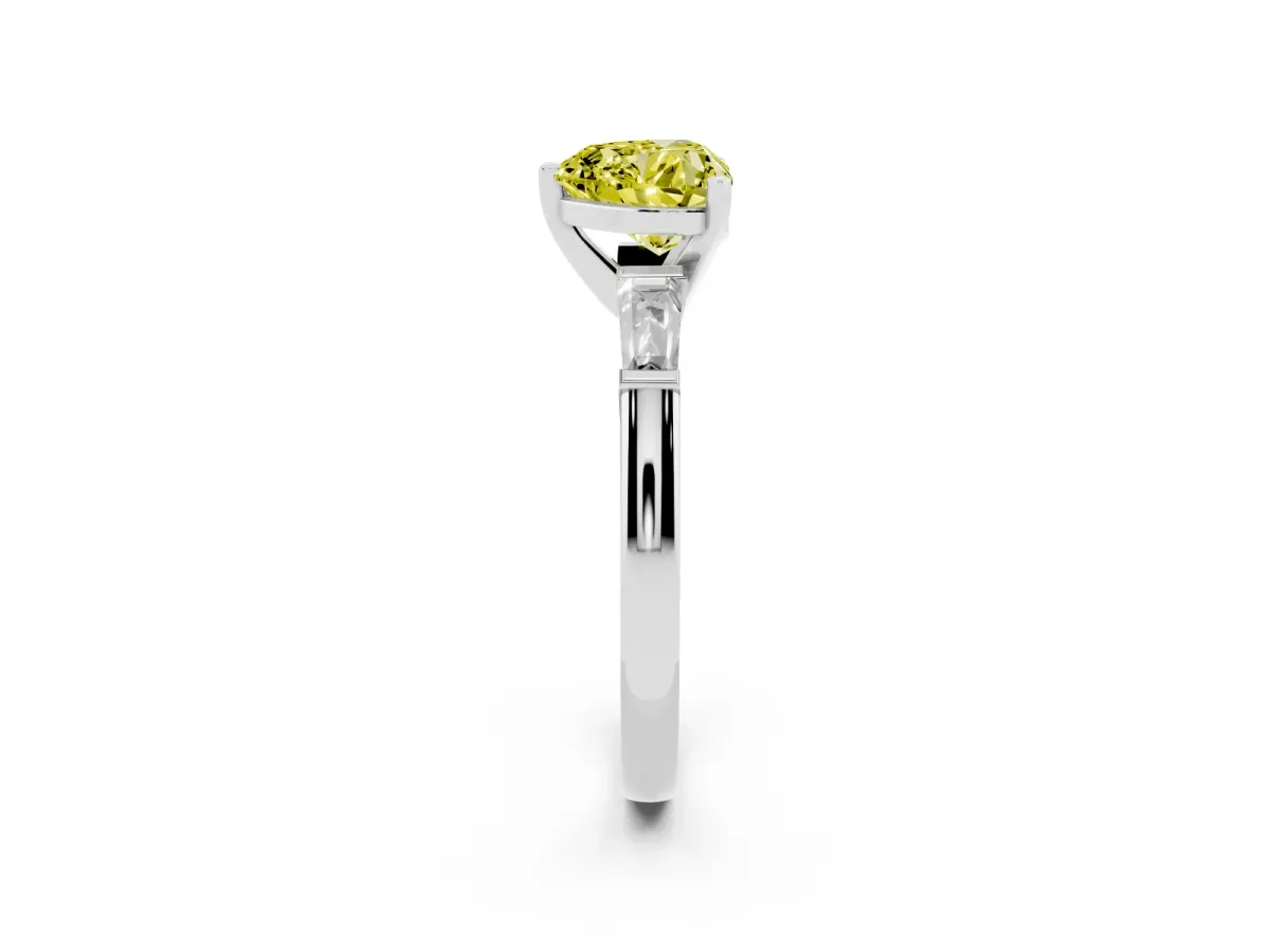Fancy Yellow Heart Cut Solitaire with Tapered Baguette Side Stones on a Classic Band with Four-Prong Setting Platinum