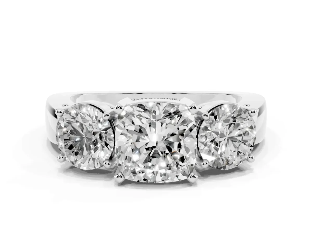 Three-Stone Cushion Cut Diamond Ring with Round Side Stones, Classic Band, and Four-Prong Setting Silver