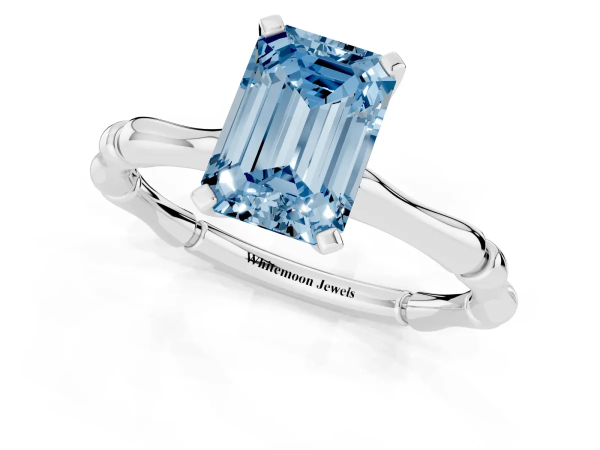 Fancy Blue Emerald Cut Solitaire Diamond Ring with Bamboo Band and Four-Prong Setting Platinum