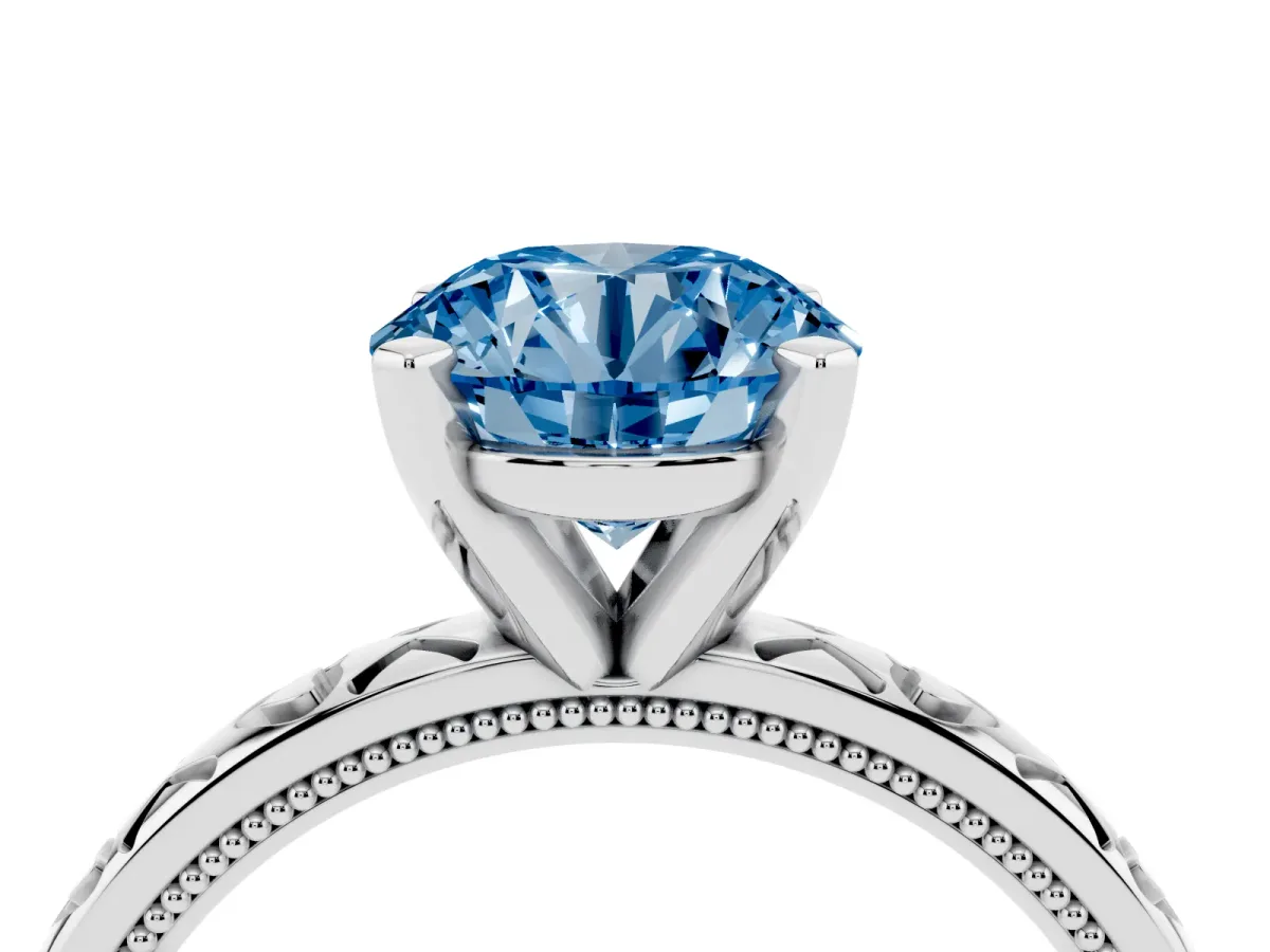 Fancy Blue Round Cut Solitaire Diamond Engagement Ring with XO Engraved Band and Four-Prong Setting Silver