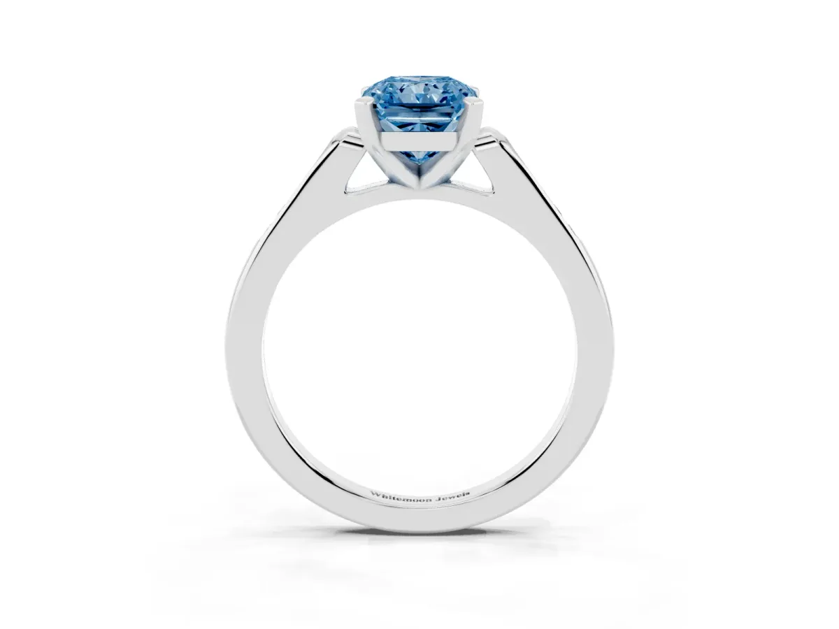 Fancy Blue Radiant Cut Diamond Solitaire Ring with Channel Set Round Band and Prong Setting Silver