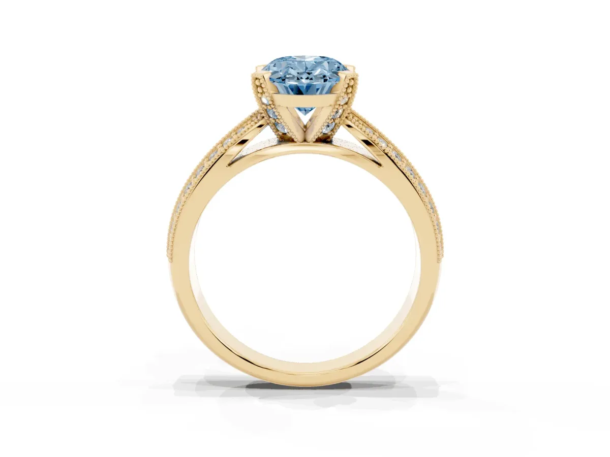 Fancy Blue Oval Cut Diamond Solitaire Ring with Milgrain Round Pavé Band and Prong Setting Yellow gold