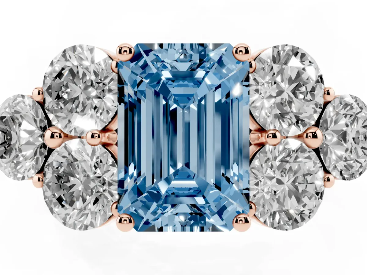 Fancy Blue Emerald Cut Cut Diamond Cluster Ring with Round Accent Stones and Prong Setting on a Classic Band Rose gold