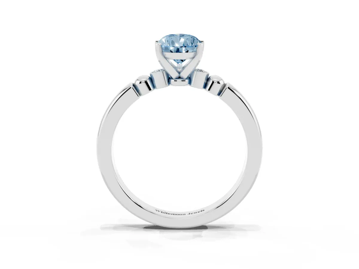 Fancy Blue Pear Cut Solitaire Beaded Band with Four-Prong Setting Silver