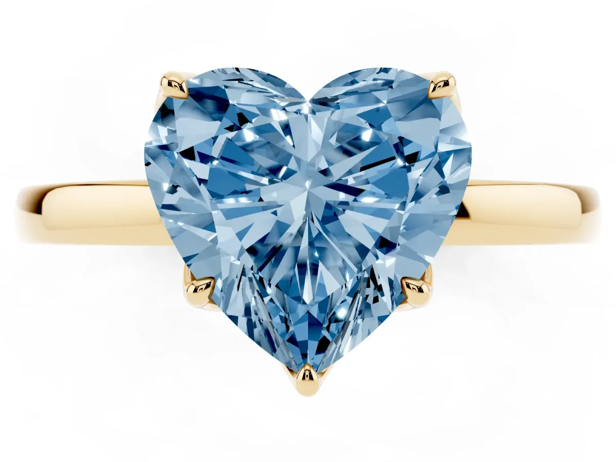 Fancy Blue Heart Cut Diamond Solitaire Ring with Thin Band and Prong Setting Yellow gold
