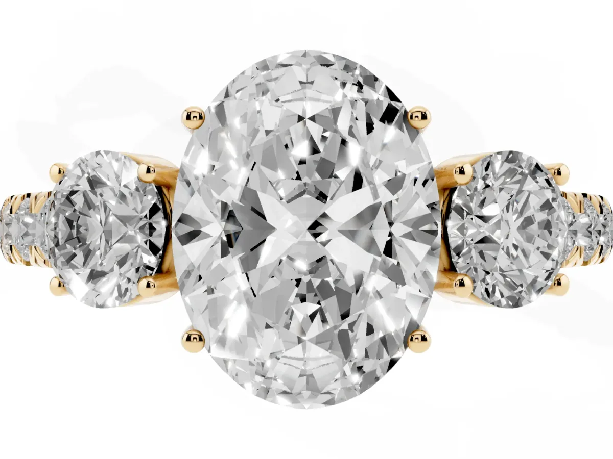 Oval Cut Cut Diamond Three-Stone Ring with Round Side Stones and Pavé Band Yellow gold