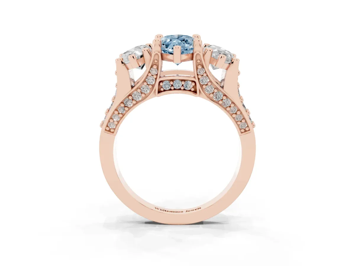 Fancy Blue Marquise Cut Diamond Three-Stone Ring with Channel Set Band and Four-Prong Setting Rose gold