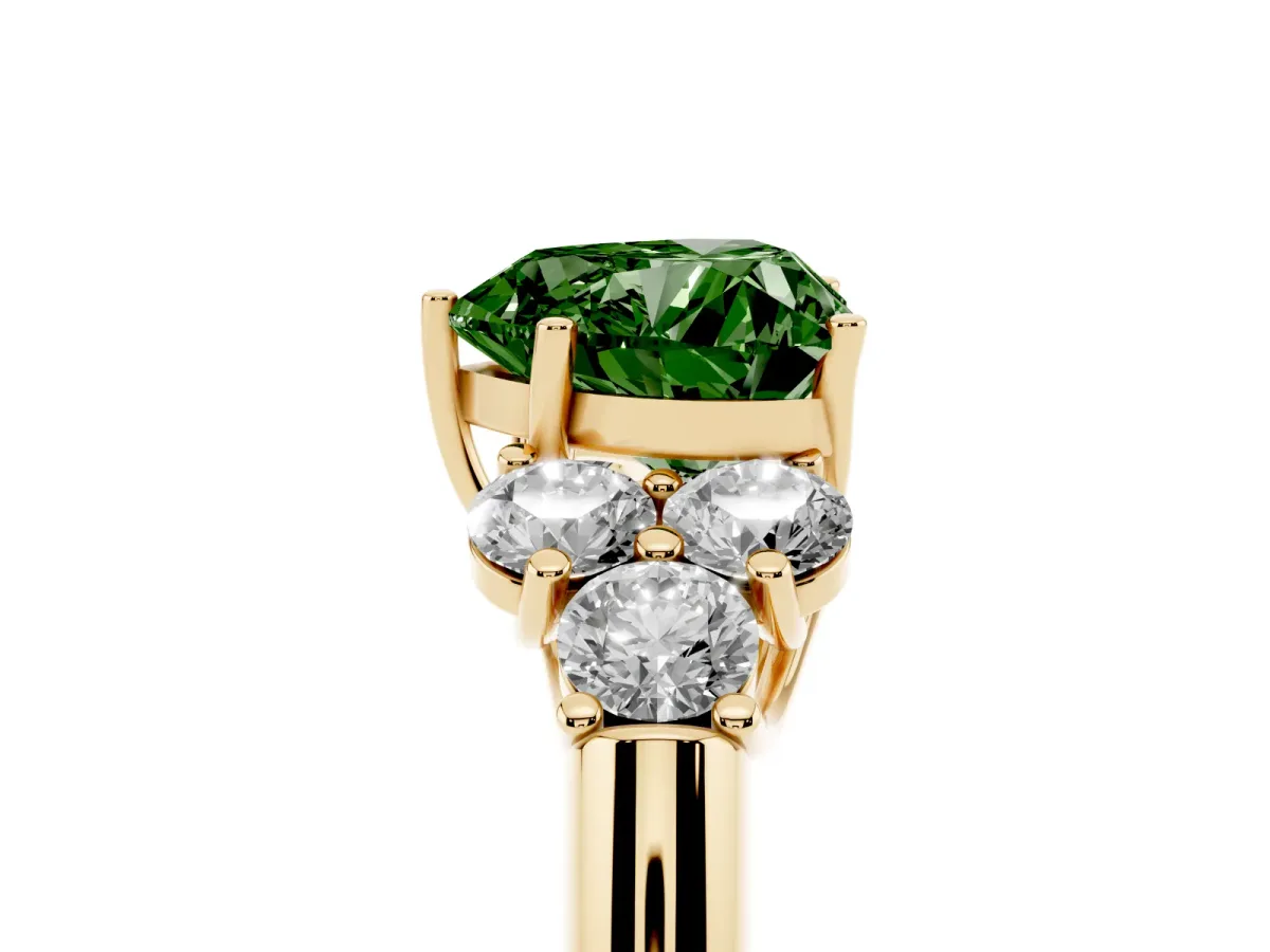 Fancy Green Heart Cut Cut Diamond Cluster Ring with Round Accent Stones and Prong Setting on a Classic Band Yellow gold
