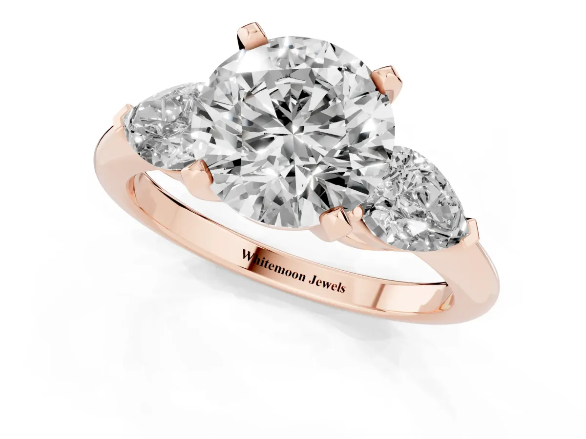 Three-Stone Round Cut Diamond Ring with Pear Side Stones and Four-Prong Setting Rose gold