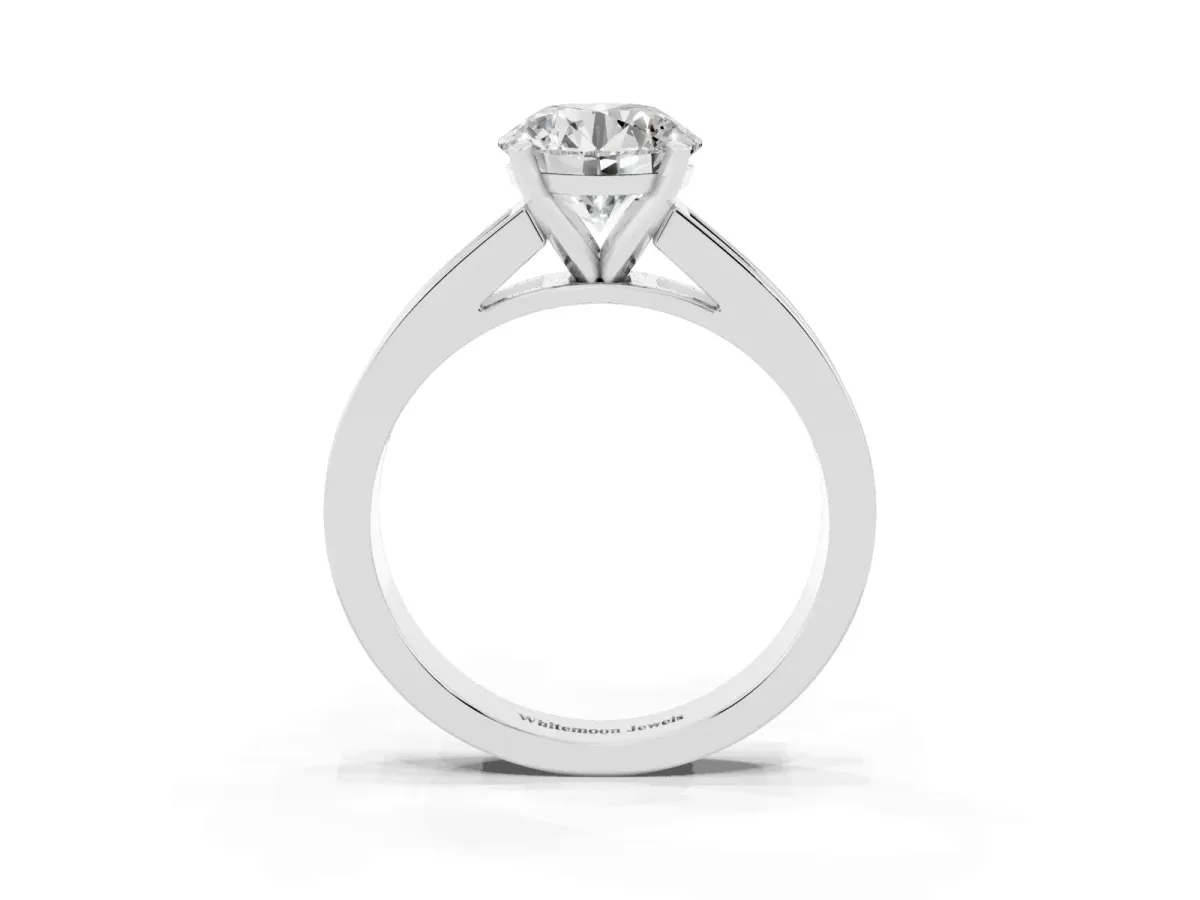 Round Cut Solitaire Diamond Ring with Channel-Set Band and Four-Prong Setting Silver