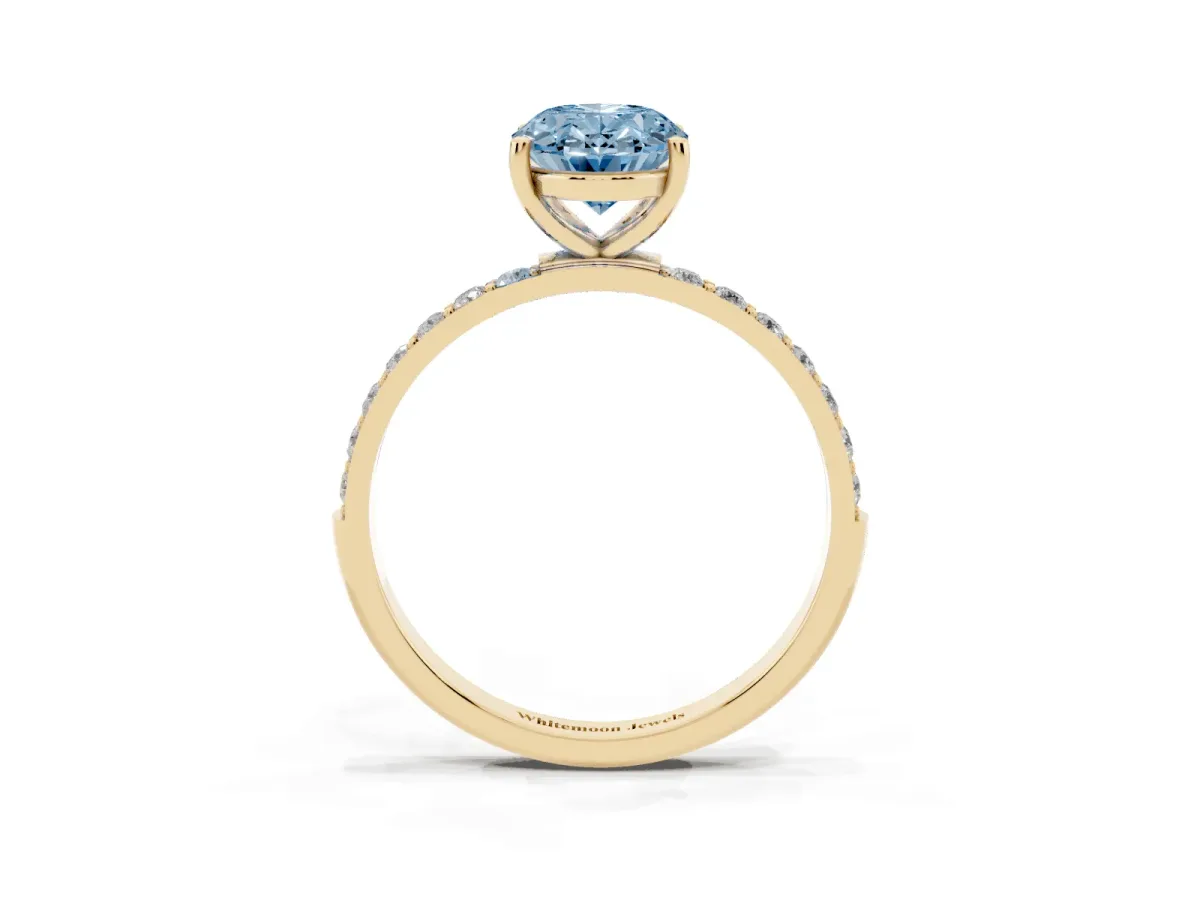 Fancy Blue Oval Cut Diamond Solitaire Ring with Round Pavé Shoulders and Prong Setting Yellow gold