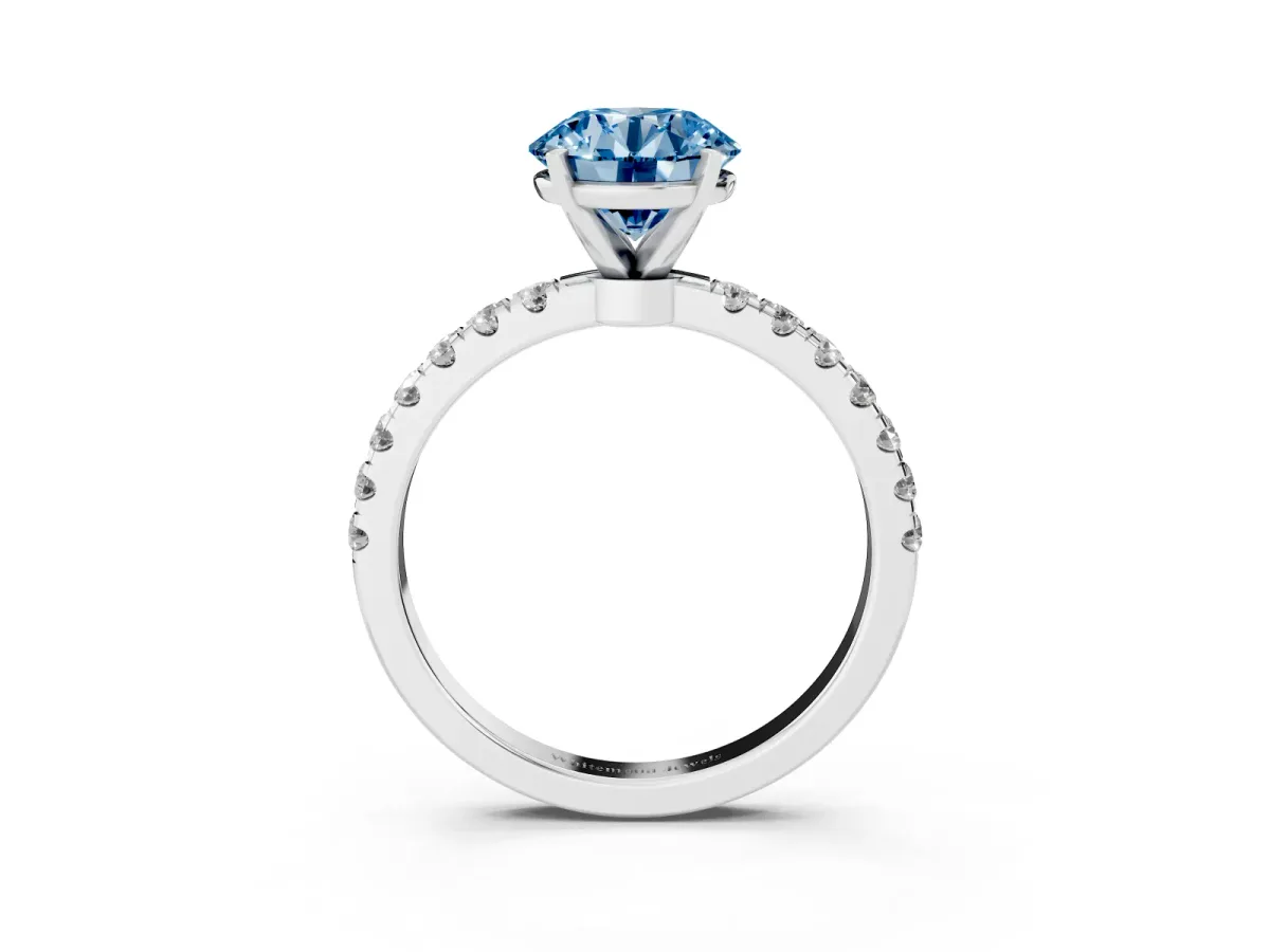 Fancy Blue Round Cut Diamond Solitaire Ring with Pavé Accents and Four-Prong Setting Platinum
