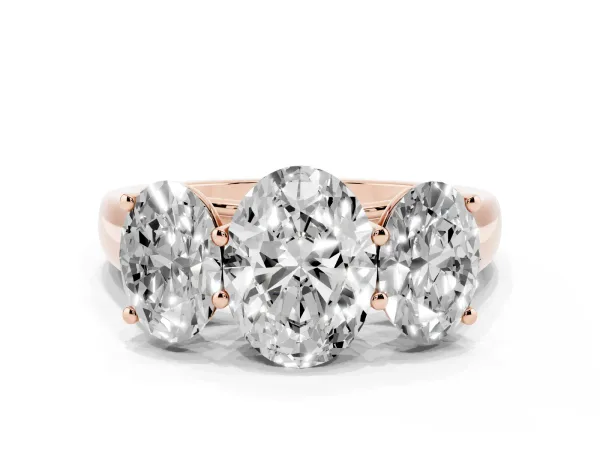 Oval Cut Three-Stone Diamond Ring with Prong Setting on a Classic Band Rose gold