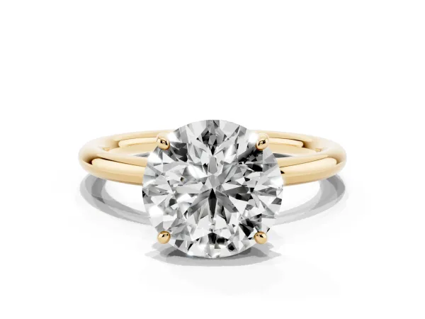 Round Cut Solitaire Diamond Ring with Four-Prong Setting on a Plain Band Yellow gold