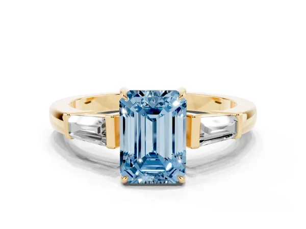Fancy Blue Emerald Cut Diamond Three-Stone Ring with Tapered Baguette Side Stones and Prong Setting Yellow gold