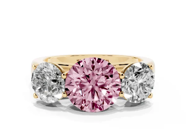 Fancy Pink Round Cut Three-Stone Diamond Ring with Prong Setting on a Classic Band Yellow gold
