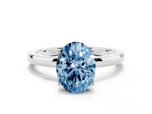 Fancy Blue Oval Cut Diamond Solitaire Ring with Thin Band and Prong Setting Platinum