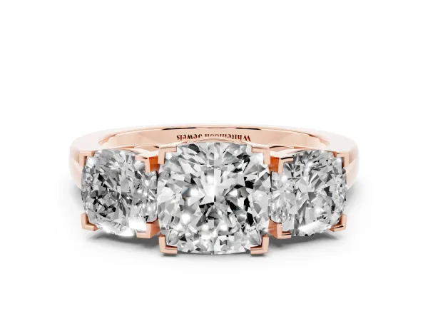 Three-Stone Cushion Cut Cut Diamond Ring with Channel Set Band and Four-Prong Setting Rose gold