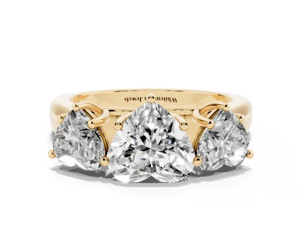 Heart Cut Three-Stone Diamond Ring with Prong Setting on a Classic Band Yellow gold