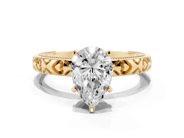 Pear Cut Solitaire Diamond Engagement Ring with XO Engraved Band and Four-Prong Setting Yellow gold