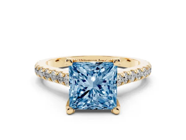 Fancy Blue Princess Cut Brilliant Diamond Solitaire with Pavé Band and Four-Prong Setting Yellow gold