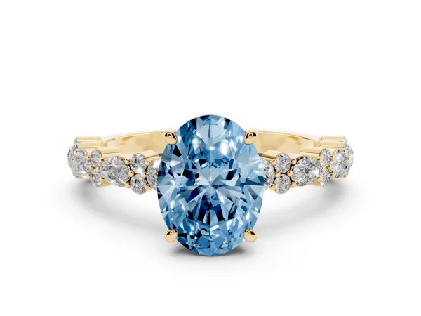 Fancy Blue Oval Cut Diamond Side Stone Solitaire Ring with Round and Four-Prong Setting Yellow gold