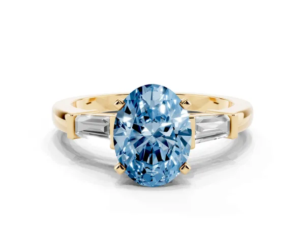 Fancy Blue Oval Cut Cut Diamond Solitaire Ring with Tapered Baguette Accents and Four-Prong Setting Yellow gold
