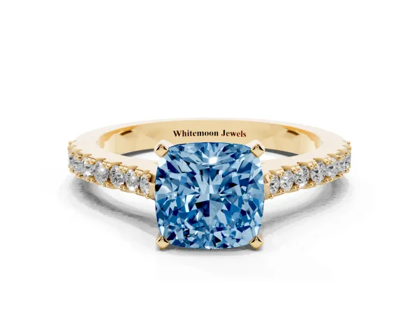 Fancy Blue Cushion Cut Cut Solitaire Diamond Engagement Ring with Pave Band and Four-Prong Setting Yellow gold